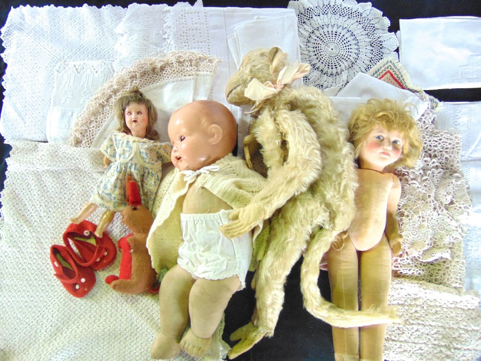 Appraisal: A box containing an assortment of vintage dolls to include