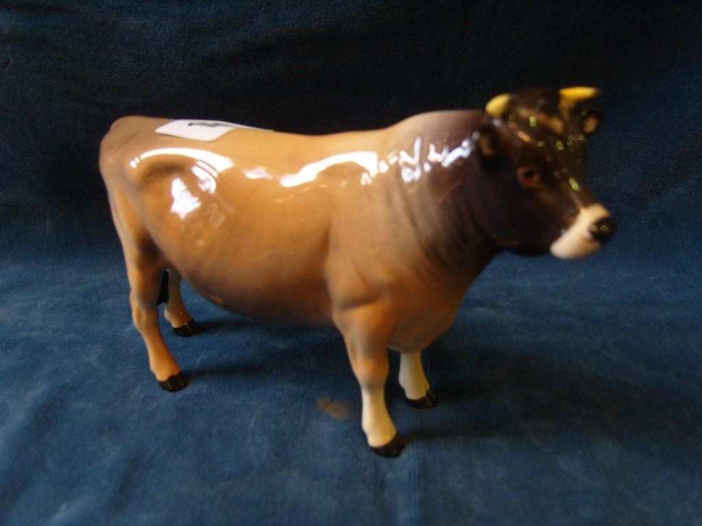 Appraisal: A Beswick model of a Guernsey bull mark to base