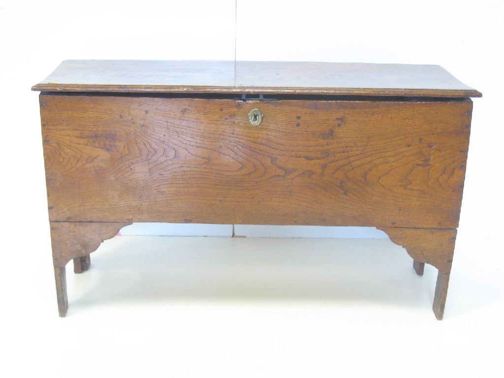 Appraisal: An antique elm Coffer with moulded top on shaped supports