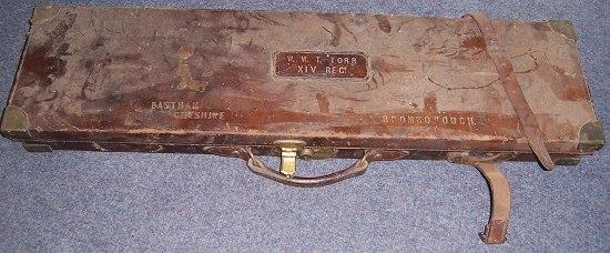 Appraisal: A brass mounted leather guncase with fitted interior bearing a