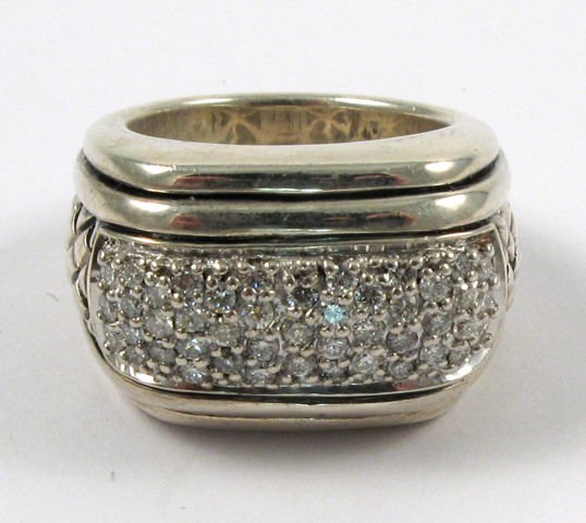 Appraisal: DIAMOND AND STERLING SILVER RING The top half of the