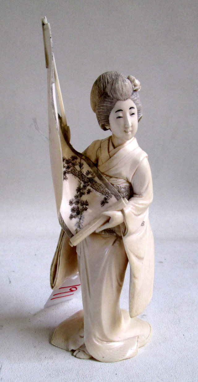 Appraisal: JAPANESE CARVED IVORY FIGURE of woman holding a scroll having