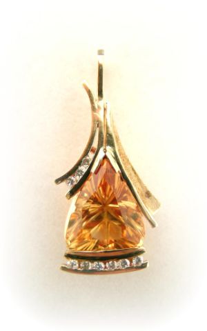 Appraisal: k yellow gold laser cut fantasy shape triangular citrine pendant