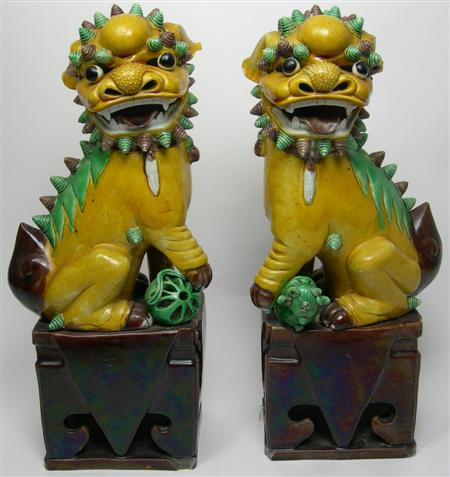 Appraisal: A pair of th century Chinese lion dogs each ochre