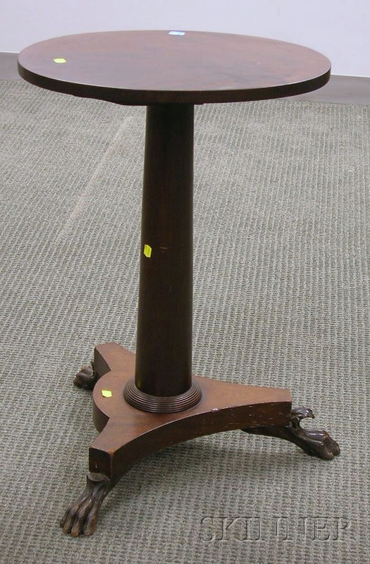 Appraisal: Empire Carved Mahogany and Mahogany Veneer Tilt-top Stand with Paw