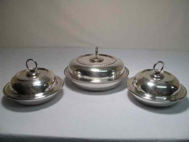 Appraisal: Lot of three silver plate lidded serving dishes The tops