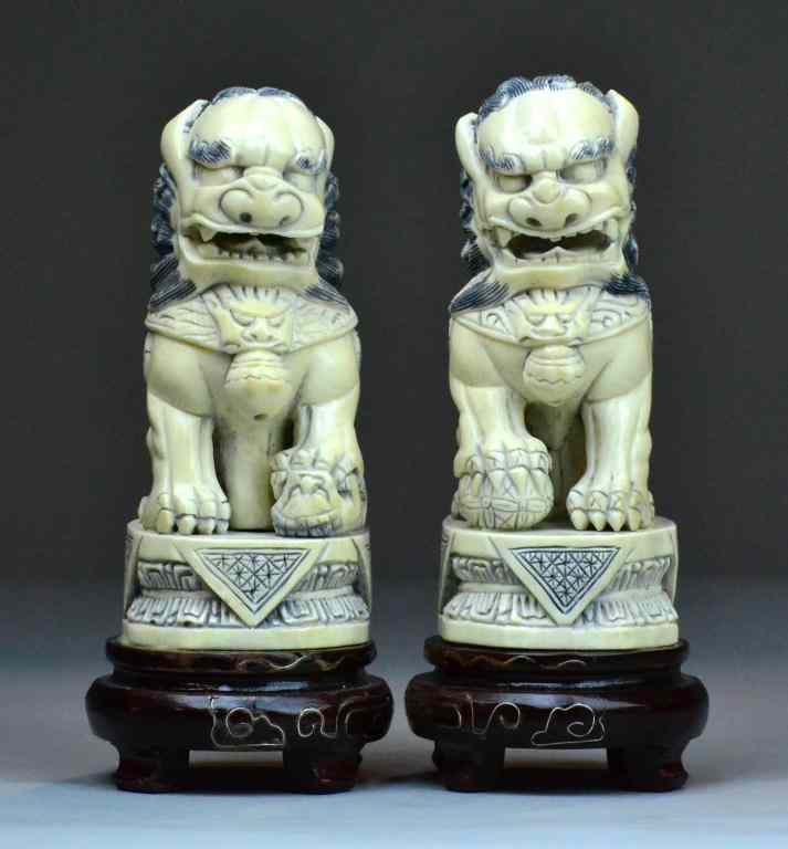 Appraisal: Pr Chinese Carved Ivory Foo DogsFinely carved to depict foo