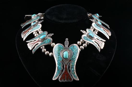 Appraisal: NAVAJO STERLING SILVER TURQUOISE AND CORAL CHIP-INLAY THUNDERBIRD NECKLACE BY