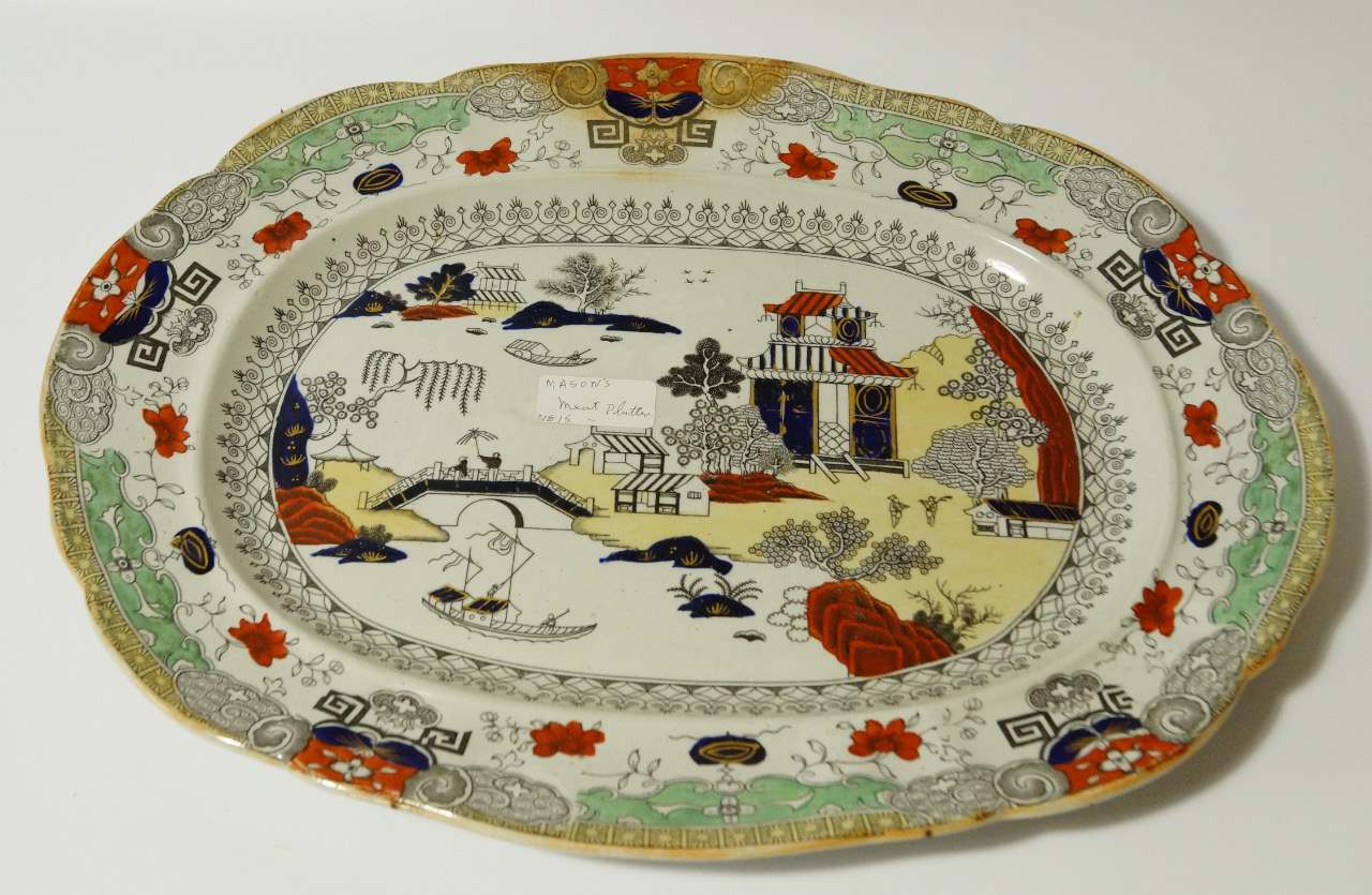 Appraisal: A thC Mason's Ironstone meat plate the shaped oval outline