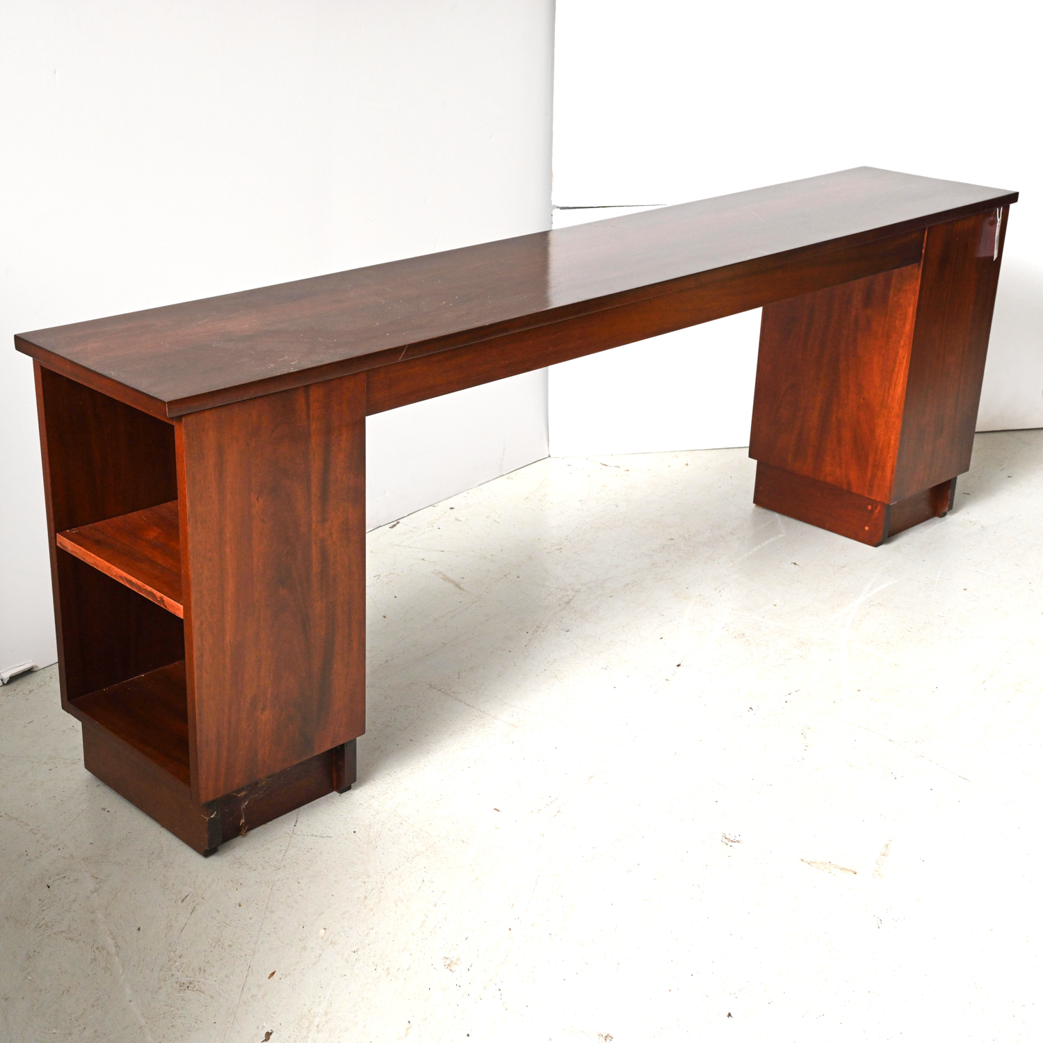 Appraisal: MODERN CONSOLE TABLE BOOKCASE th c long sleek console table