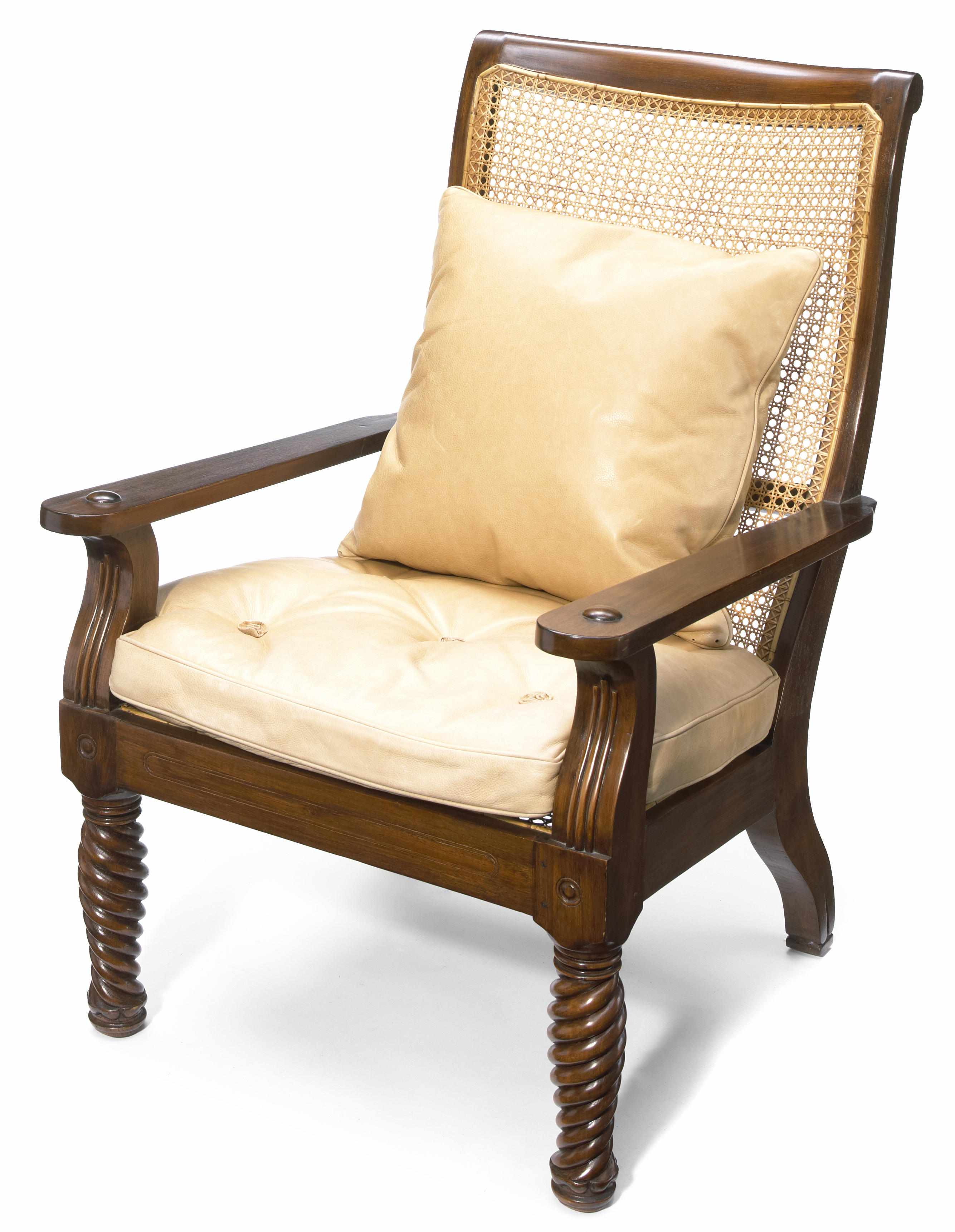 Appraisal: A Continental hardwood and cane panel plantation armchair with leather