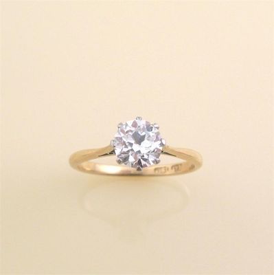 Appraisal: A diamond solitaire ring The circular cut diamond weighs approximately