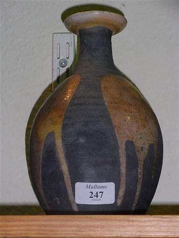 Appraisal: A SIMON LEACH STUDIO POTTERY STONEWARE VASE on black ground