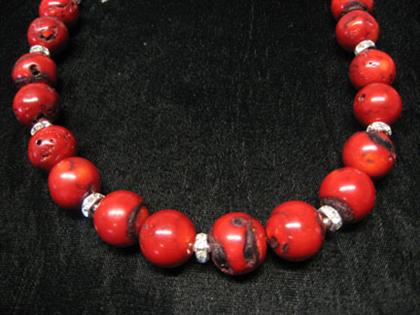 Appraisal: Coral bead necklace Large round coral beads with sterling silver