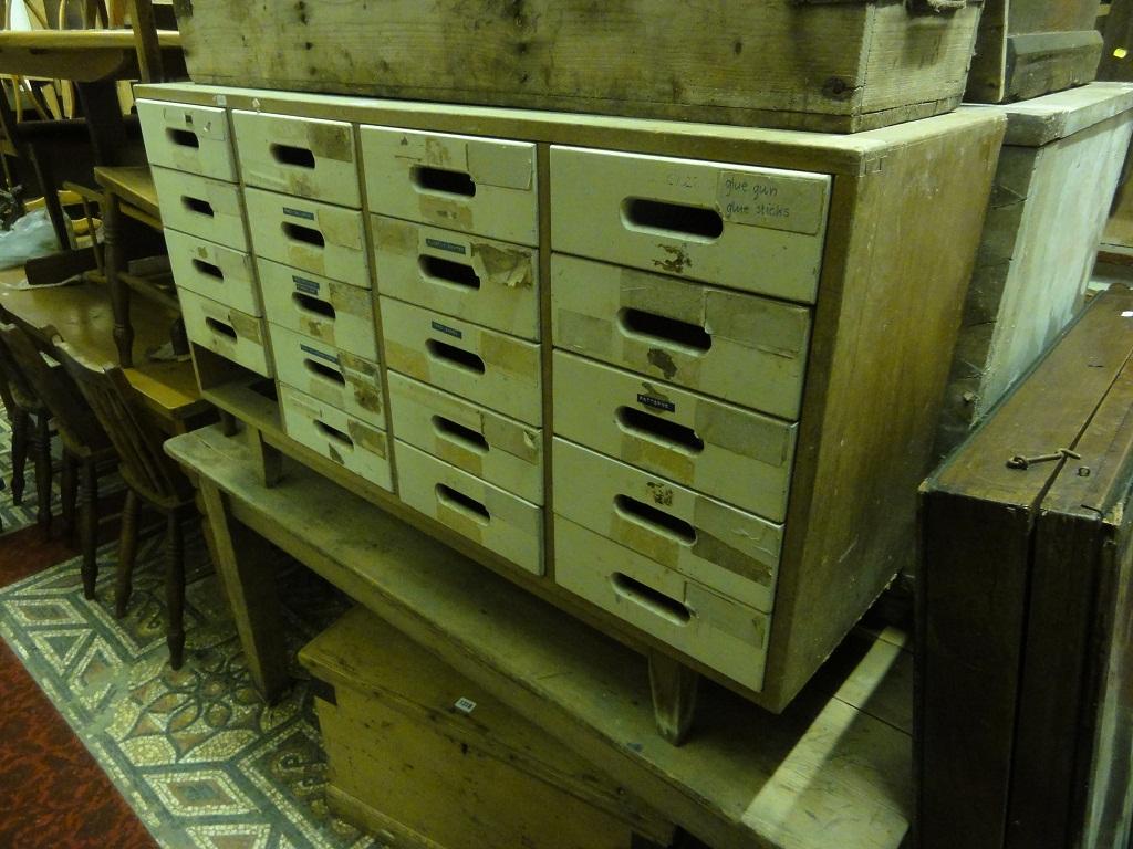 Appraisal: A freestanding cabinet enclosing an arrangement of twenty small drawers