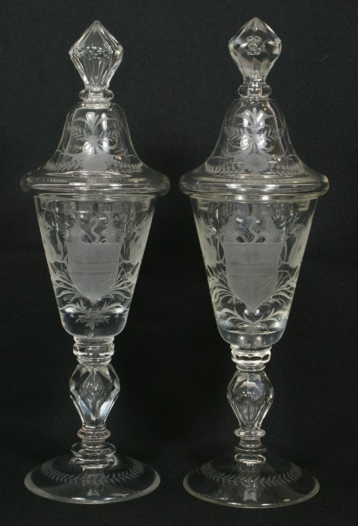 Appraisal: Pr engraved Bohemian clear crystal pokals gryphons flanking a coat