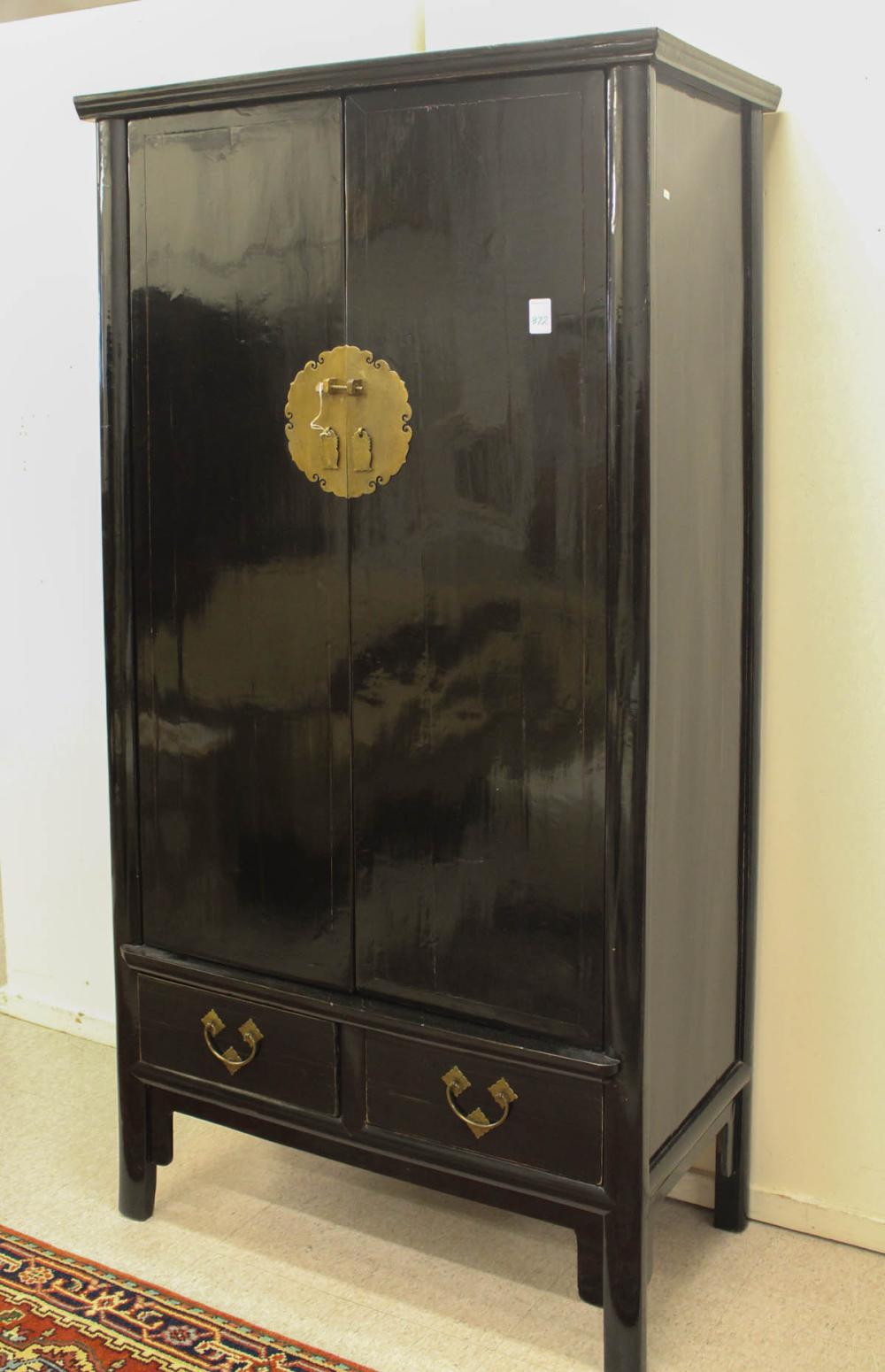 Appraisal: CHINESE MING STYLE DOUBLE-DOOR CABINET the interior fitted with two