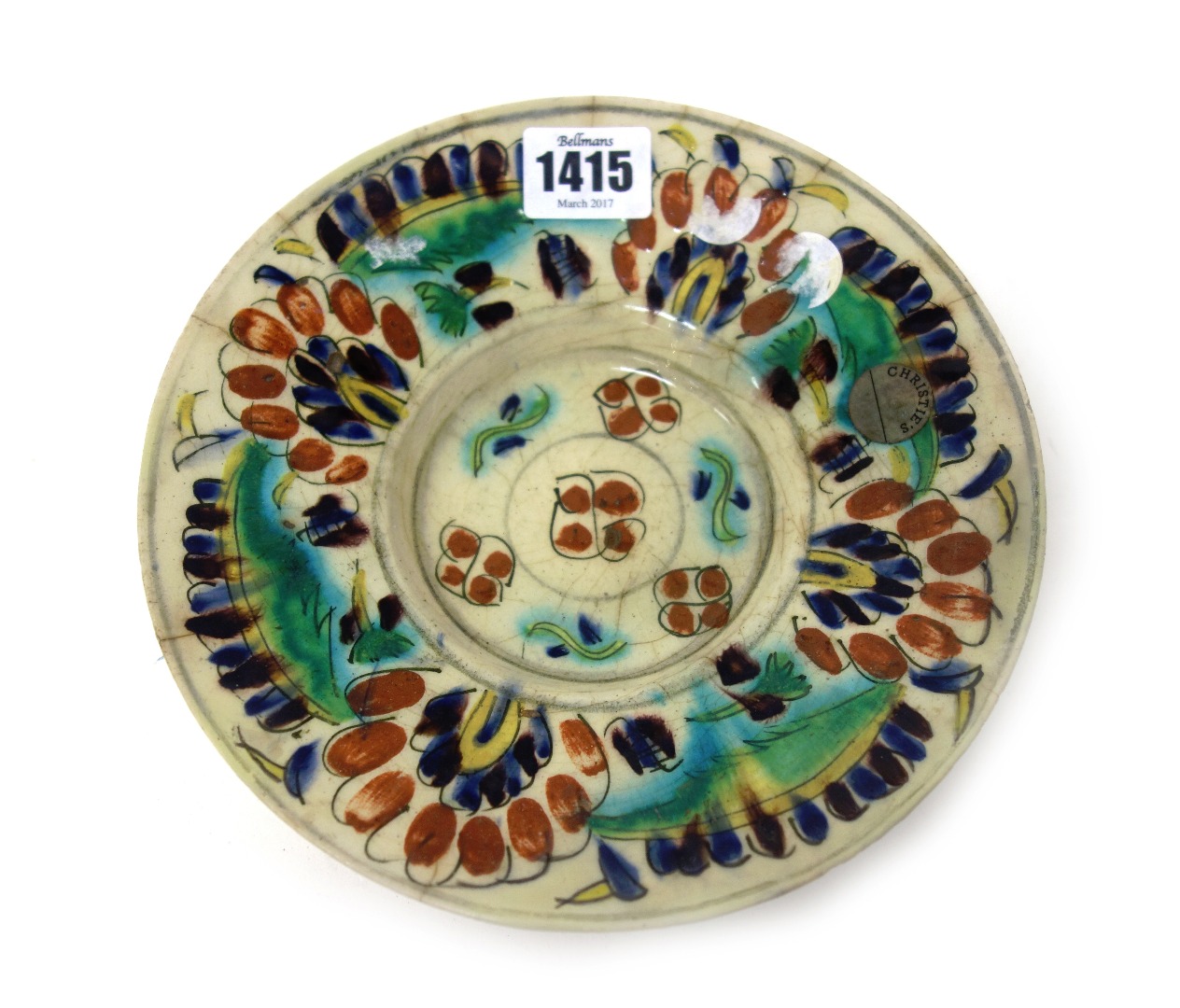 Appraisal: A Kutayha pottery saucer dish th century painted with stylized