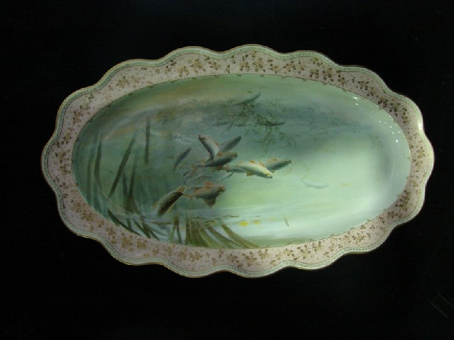 Appraisal: A Doulton Burslem oval fish plate centrally painted with swimming