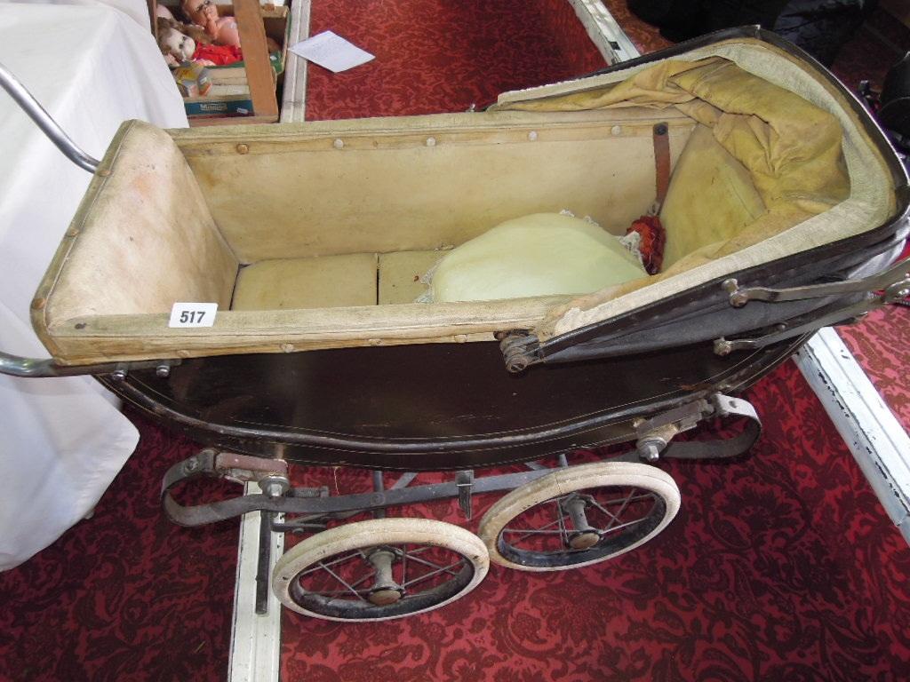 Appraisal: An early th century toy nanny's pram on sprung suspension