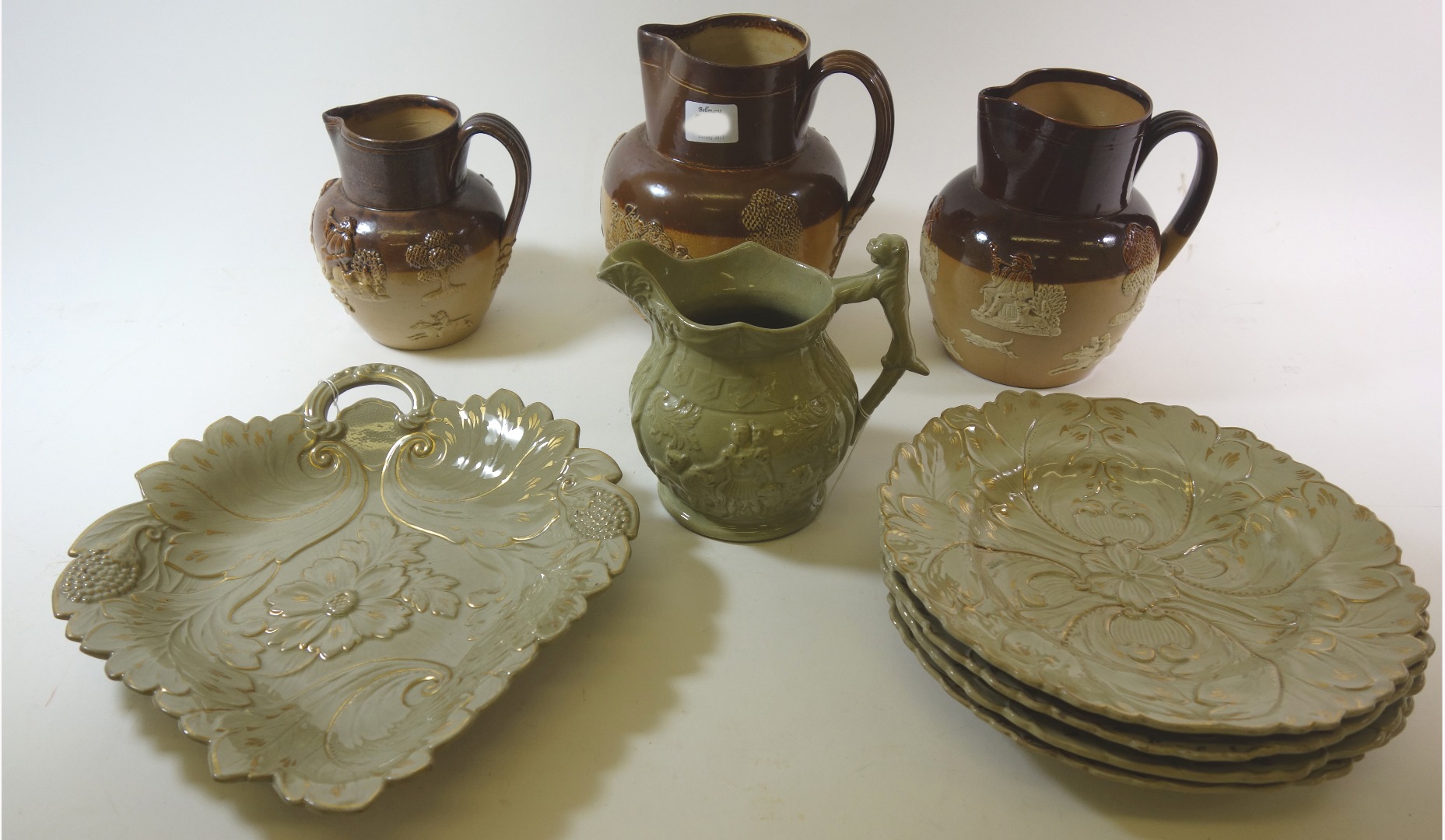 Appraisal: Two Doulton stoneware 'Harvest' jugs another similar a Drabware jug