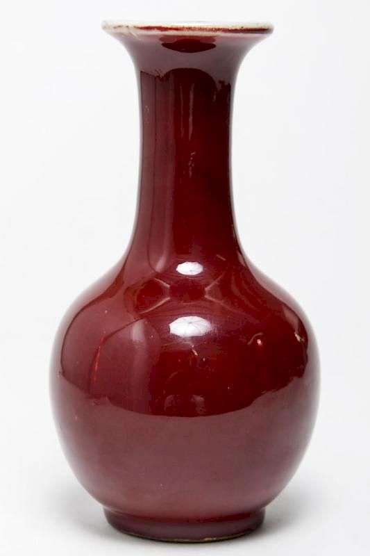 Appraisal: Chinese Qing Dynasty Oxblood-Glazed Bottle Vase Chinese Qing Dynasty oxblood-glazed