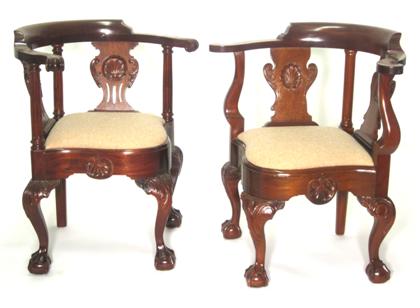 Appraisal: Two Chippendale style carved mahogany corner arm chairs late th