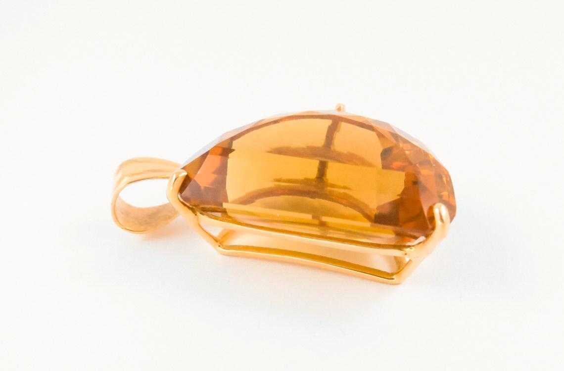 Appraisal: CITRINE AND FOURTEEN KARAT GOLD PENDANT with three yellow gold