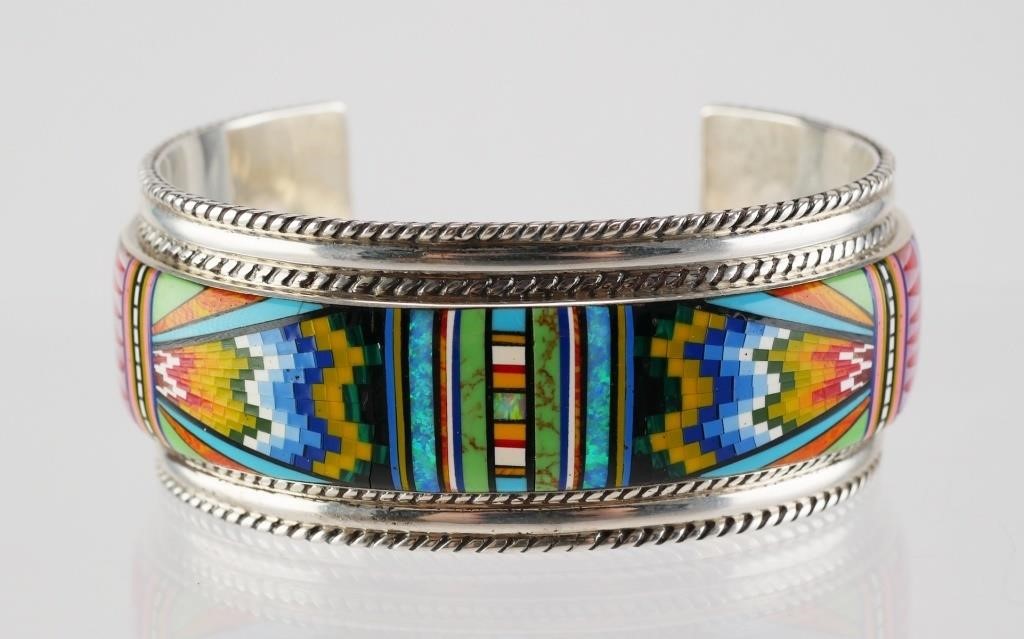 Appraisal: Sterling silver cuff bracelet featuring Native American style multi-colored design