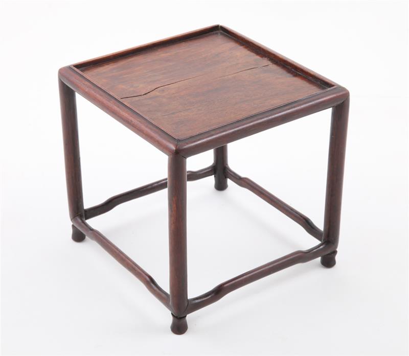 Appraisal: CHINESE HARDWOOD MINIATURE TABLE With inset panel top raised on