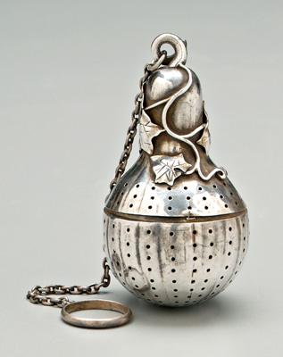 Appraisal: Sterling squash form tea strainer applied vine and leaf decoration