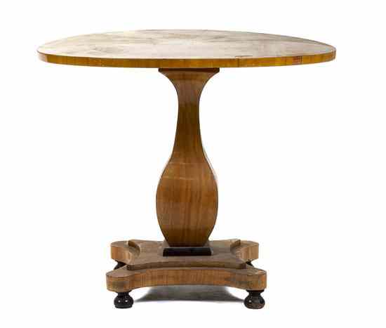 Appraisal: A Biedermeier Style Birch and Ebonized Center Table having a