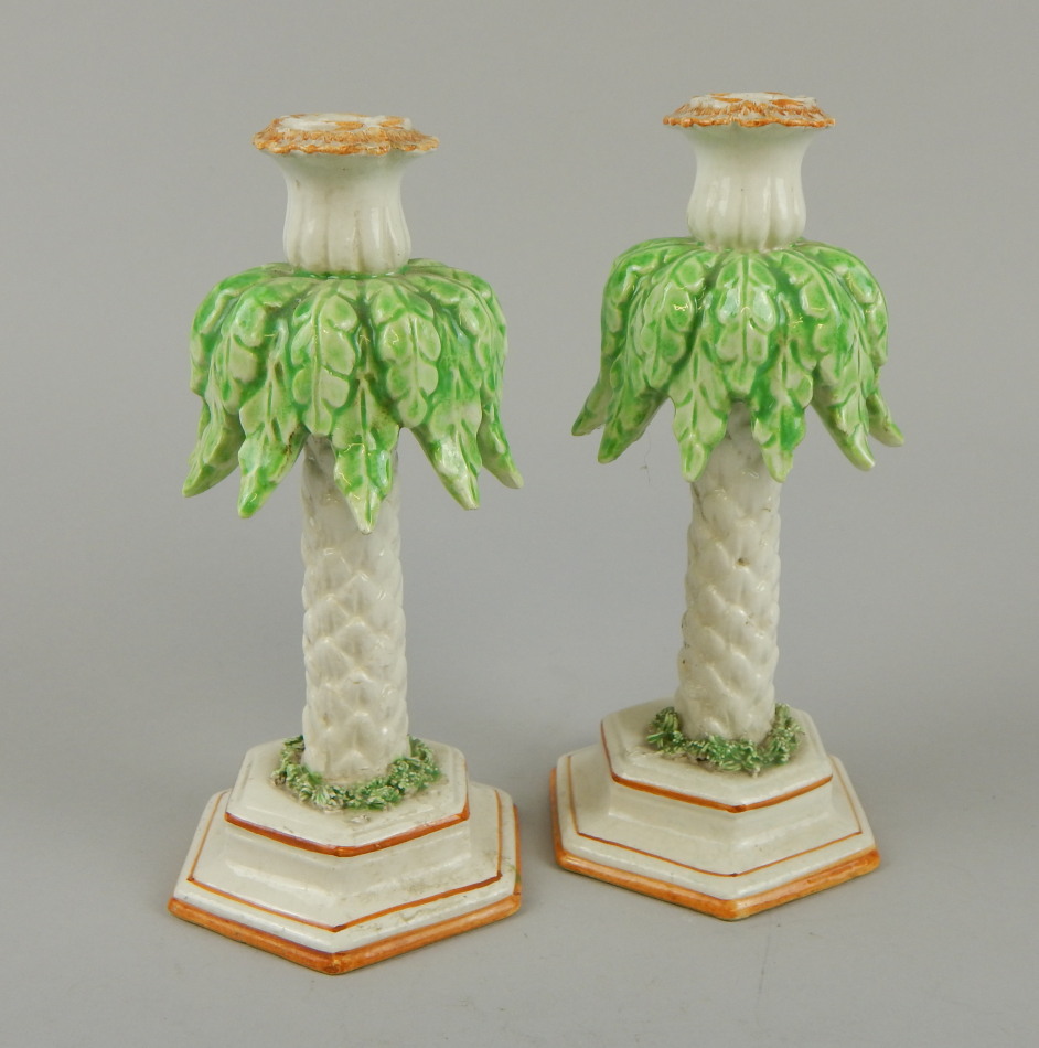 Appraisal: A pair of thC Staffordshire palm tree shaped candlesticks with