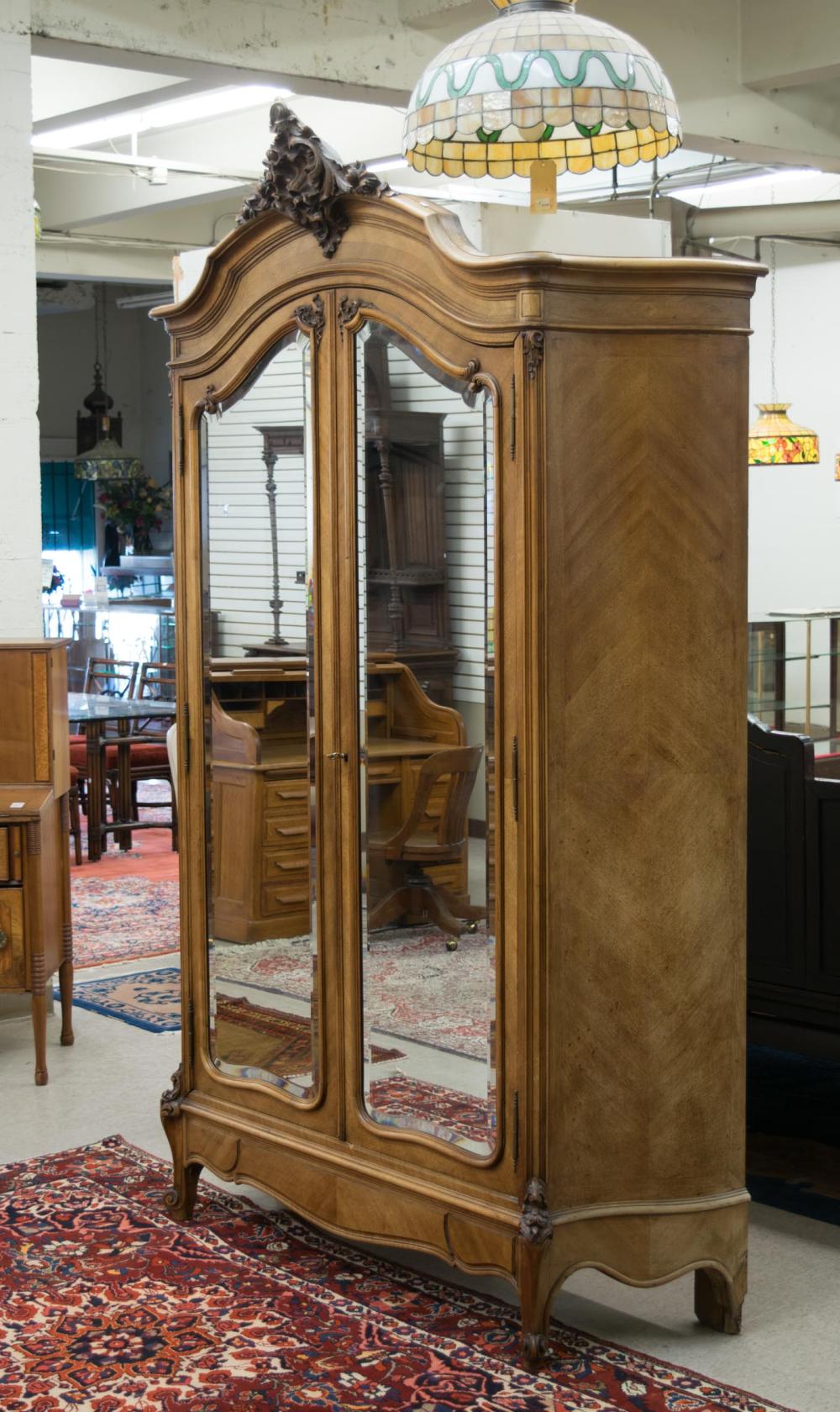 Appraisal: LOUIS XV STYLE DOUBLE-DOOR WALNUT ARMOIRE French c the doors