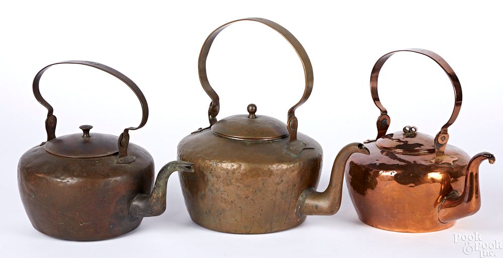 Appraisal: Three Pennsylvania copper kettles Three Pennsylvania copper kettles th c