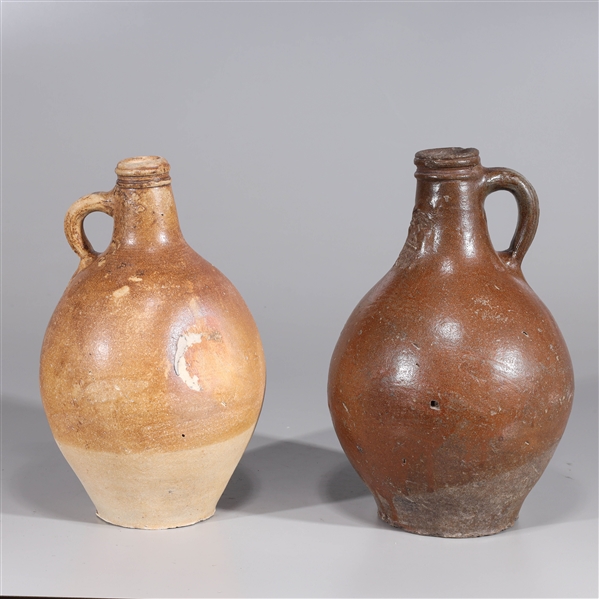 Appraisal: Two tall-necked German Bellarmine jugs likely th century or earlier