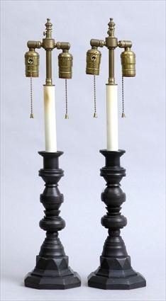 Appraisal: PAIR OF BAROQUE-STYLE BLACK SLATE CANDLESTICK LAMPS Each segmented stem