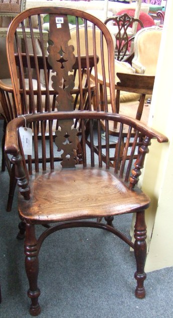 Appraisal: A early th century yew and elm Windsor armchair with