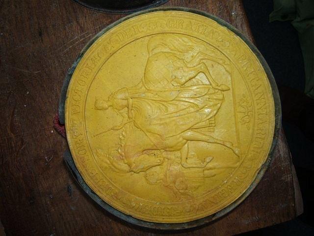 Appraisal: A LARGE VICTORIAN YELLOW WAX DOCUMENT SEAL depicting Victoria enthroned