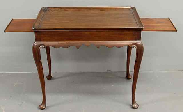 Appraisal: Henkel-Harris Queen Anne style mahogany tea table with pull-out slides