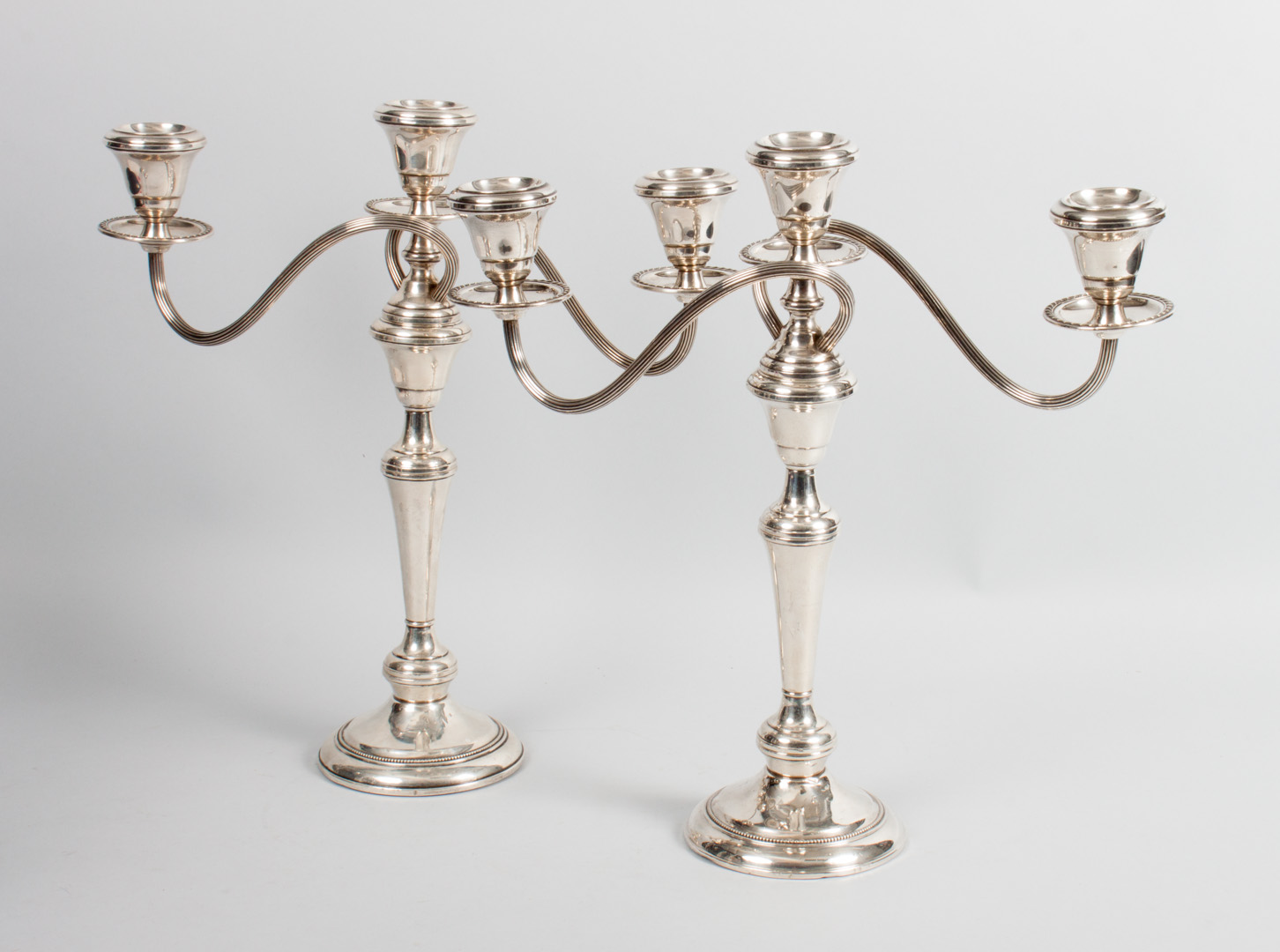 Appraisal: Pair of Wallace weighted-sterling candelabra three-light candelabra in H