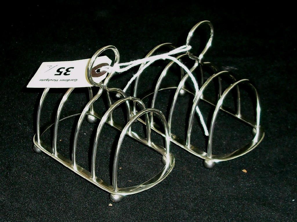 Appraisal: Pair of Victorian four division toast racks wide maker J