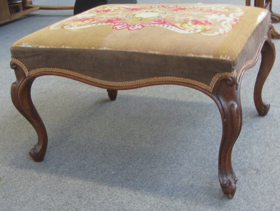 Appraisal: A th century walnut framed footstool on cabriole supports x