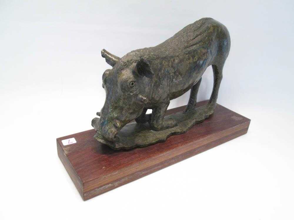 Appraisal: CARVED RUBY VERDITE BOAR SCULPTURE depicting a kneeling boar Height