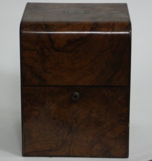 Appraisal: A walnut veneered decanter box with three decanters and another