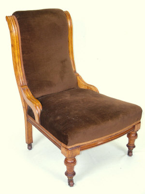 Appraisal: A mahogany elbow chair th century with spindle turned back