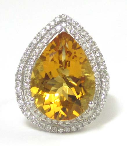 Appraisal: CITRINE DIAMOND AND FOURTEEN KARAT GOLD RING The white gold