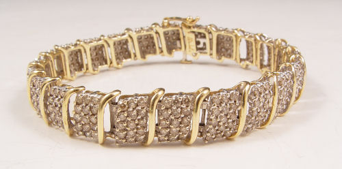 Appraisal: CTW DIAMOND BRACELET K yellow gold bracelet contains round full