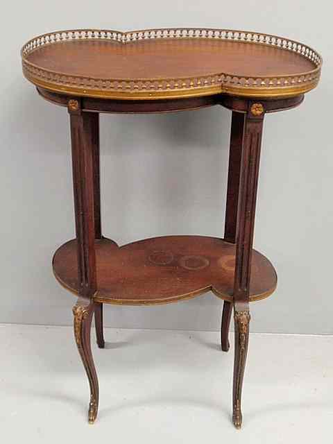 Appraisal: French mahogany occasional table early th c with a shaped