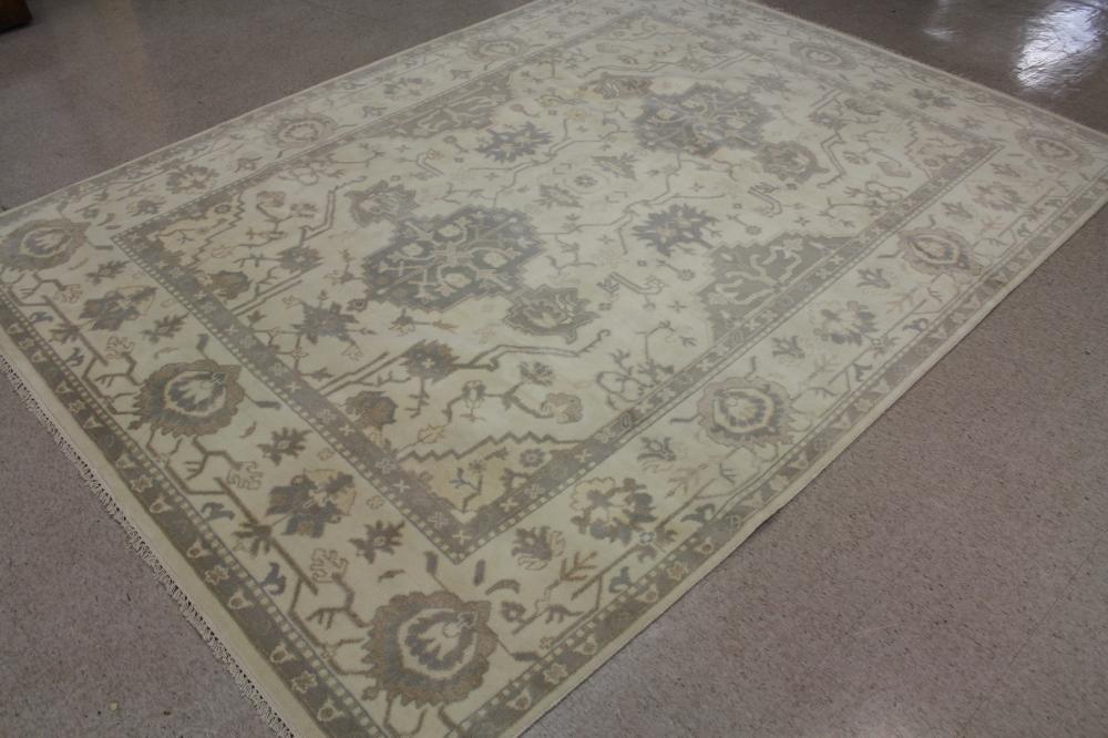 Appraisal: HAND KNOTTED ORIENTAL CARPET Indo-Persian double geometric medallion and stylized